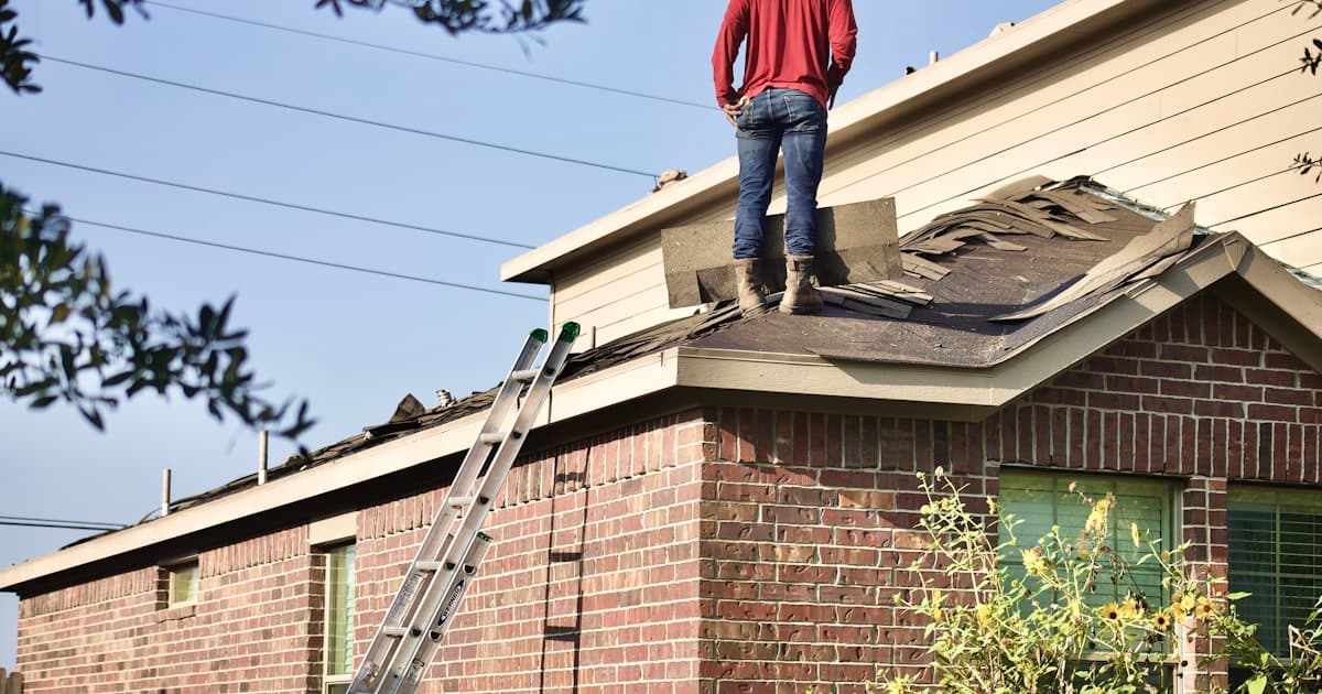 Roofer working on home roof